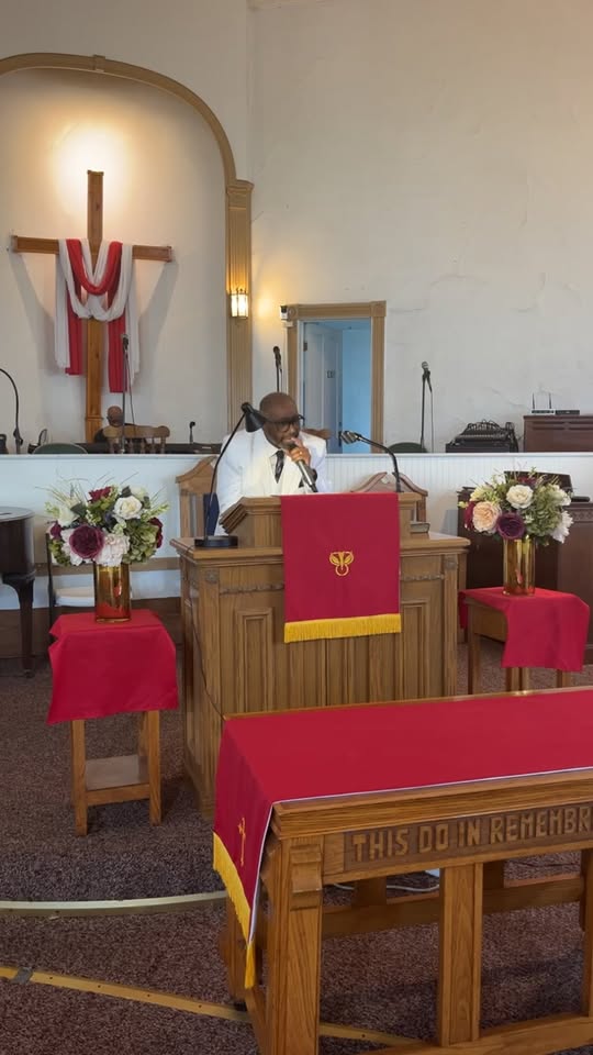 Pastor Troy preaching at the pulpit at Promiseland MBC