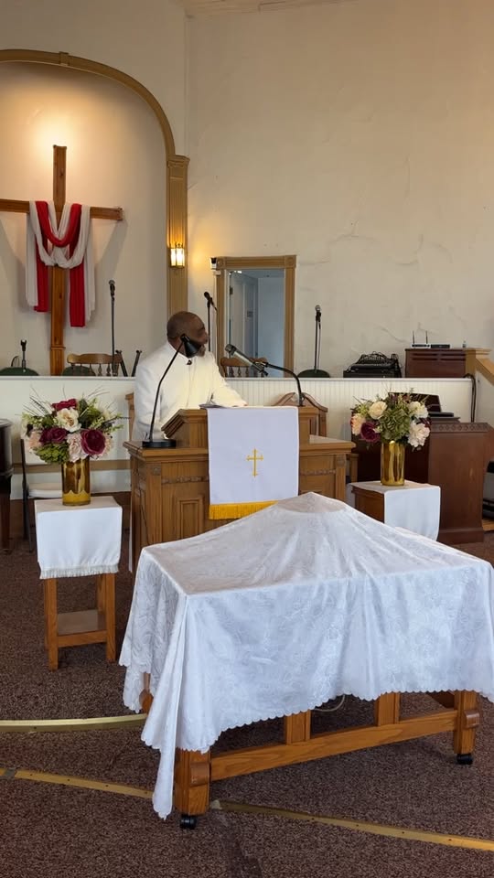 Pastor Troy leading Sunday worship at Promiseland MBC